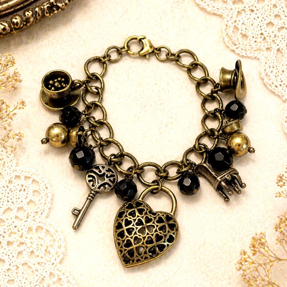 Disney Brass Tone Black Bead Alice In Wonderland Themed Charm Bracelet